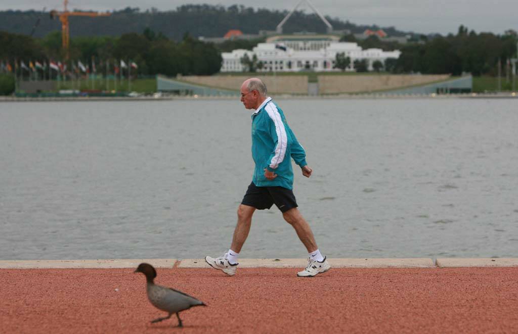 Former prime minister John Howard was a familiar figure power walking in the streets. Photo: Andrew Taylor