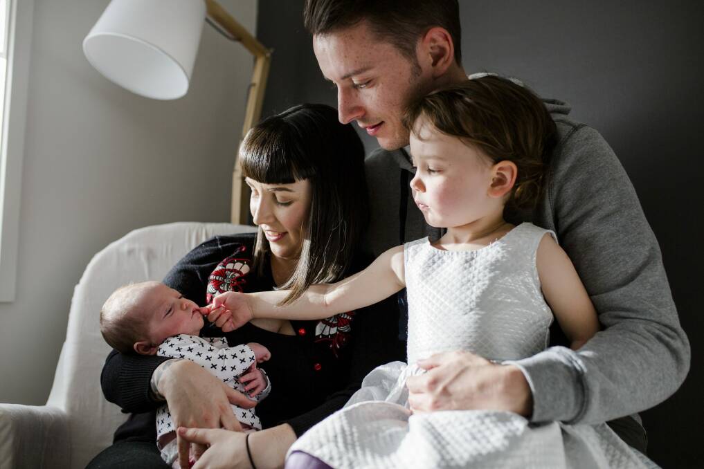 Lauren Napper-Ferrari and her partner Chris Richardson, with their daughters Aida, 3, and May, four-weeks-old. Photo: Jamila Toderas