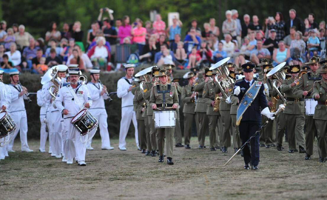 Canberra's Anzac centenary tribute began with a traditional beating retreat ceremony on the Patrick White Lawns in front of the National Library of Australia.  Photo: Melissa Adams 