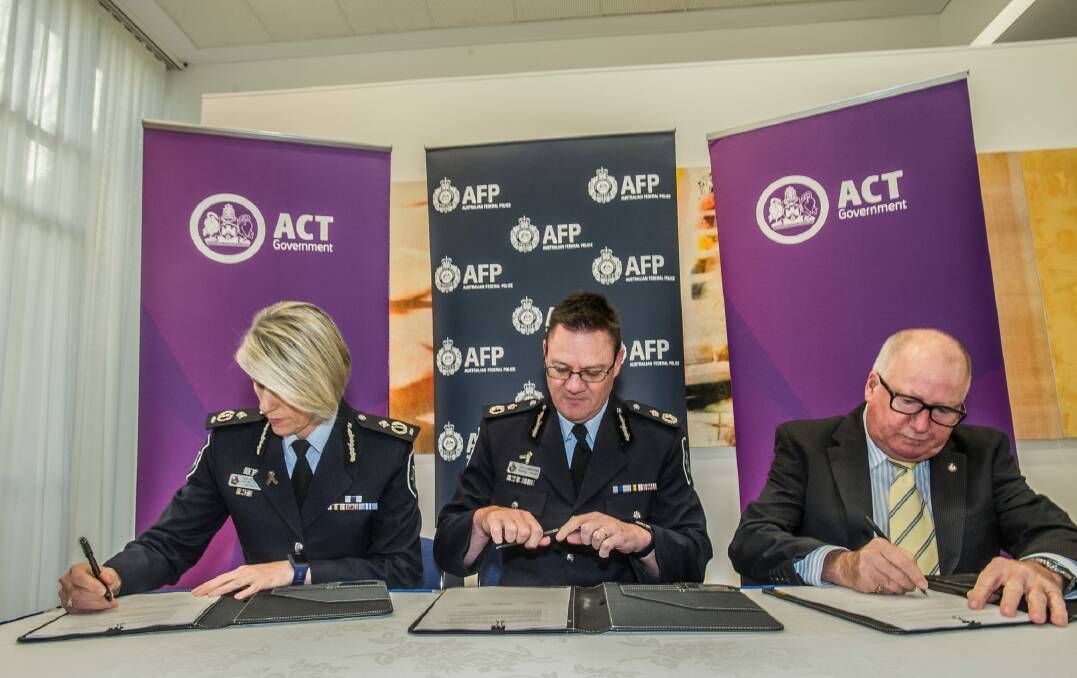 Ministerial direction delivered by Police and emergency services minister Mick Gentleman (right) - and four year purchase agreement signed by , Chief policing officer Justine Saunders (left) and acting AFP Commissioner Michael Phelan. Photo: Karleen Minney