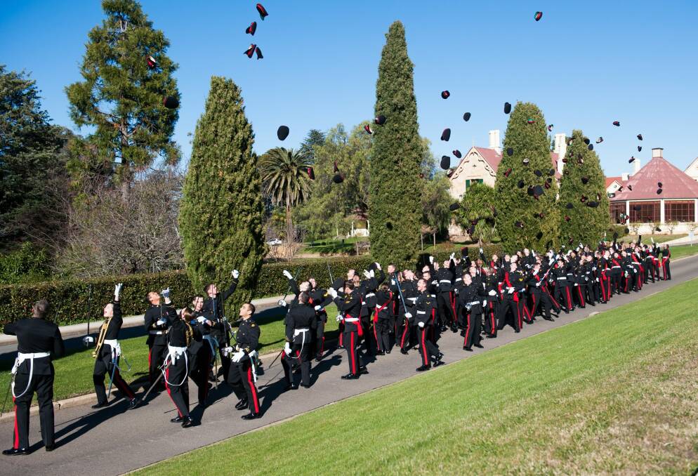 It's a special moment when graduates throw their hats into the air. Photo: Elesa Kurtz