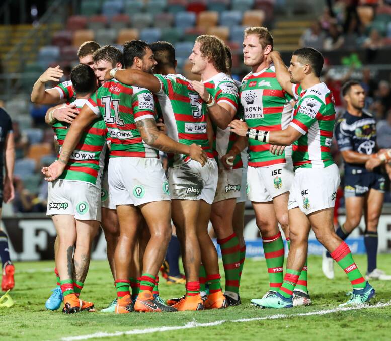 Last-gasp: South Sydney celebrate after snatching victory over the Cowboys with the last kick of the game. Photo: AAP