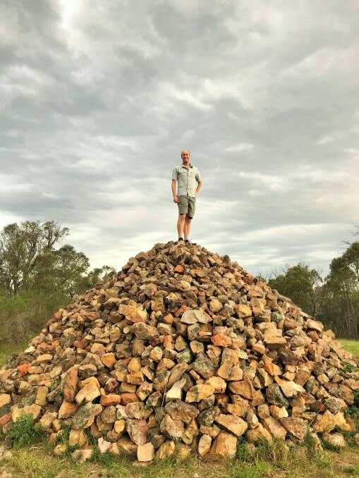 David Osmond of Dickson on the rock cairn atop Gossan Hill Photo: Meg Osmond