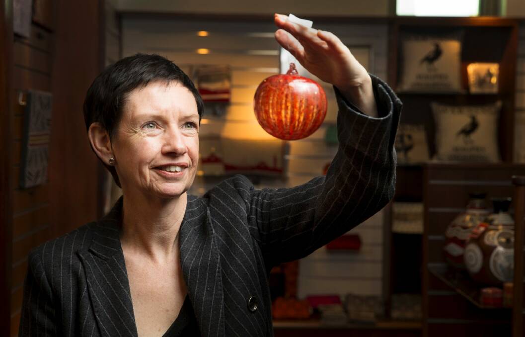 Carol Mills in the Parliament House Gift Shop with some Canberra made products. Photo: Matt Bedford