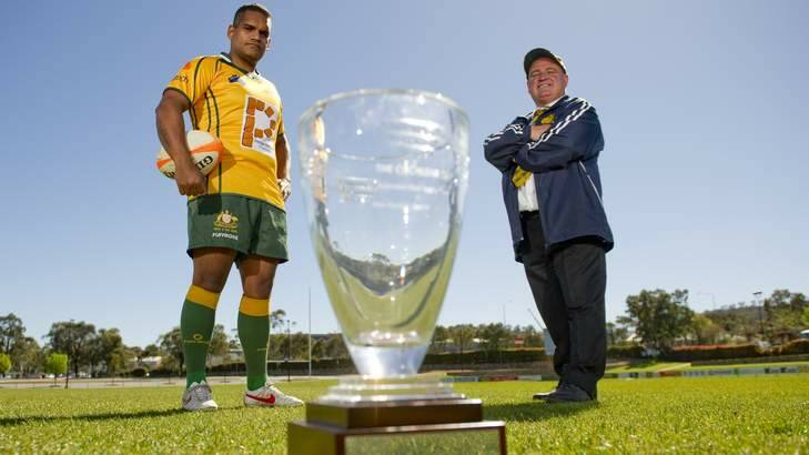 Right winger for the Deaf Rugby Australian Team, Robert Dalton and coach David Murray with the Cochlear Cup. Photo: Jay Cronan