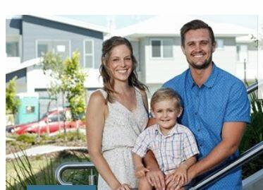 Aura's Ryan McIntyre and his family at the new residential estate at Caloundra South, where a future rail link will run. Photo: Supplied