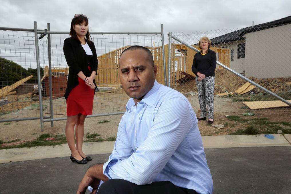 Homeowners Ling Palm with her husband Nicholas Palm and design consultant Angela Penhallow.  The Palm's had got Andara Homes to build their home in Ngunnawal in July of last year but switched builders in December.  Angela worked on several projects for Andara Homes [not the Palm's] and she is owed money too. Photo: Jeffrey Chan