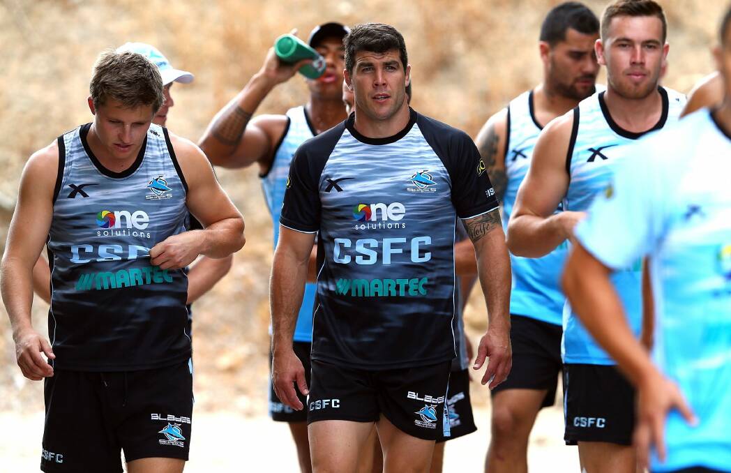 Michael Ennis, centre, turned down a massive offer from the Raiders to join the Sharks. Photo: Getty Images