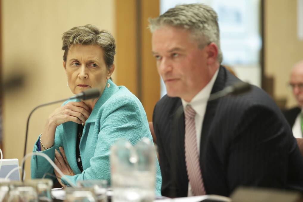 Finance Department head Rosemary Huxtable with her minister Mathias Cormann during estimates last month. Photo: Alex Ellinghausen