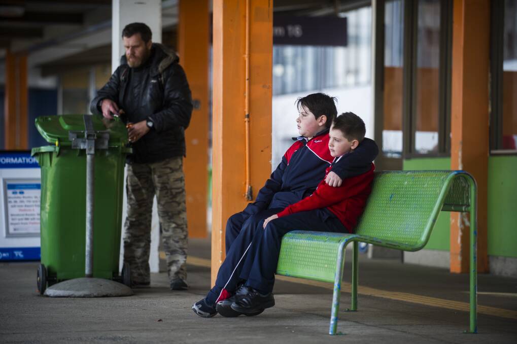 Noah Sham, 10, and Elijah Sham, 7, of Brindabella Christian College would have had to get on a public bus and make multiple connections to get to school from the Woden bus interchange under the new network. Photo: Dion Georgopoulos
