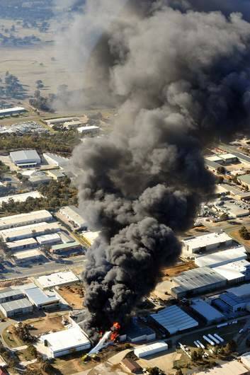 HAZARDOUS: Black smoke pours from the EPI plant at Mitchell. Photo: karleen minney