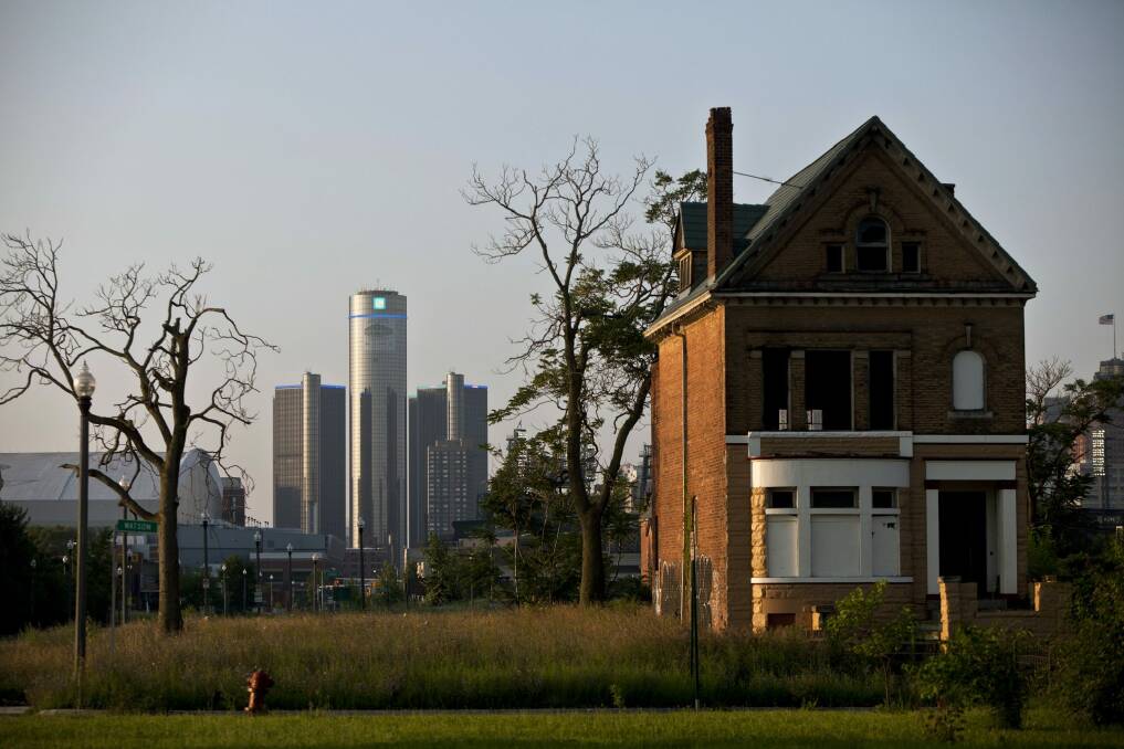 A vacant, boarded up house on the outskirts of Detroit tells the story of the city's past. Photo: New York Times
