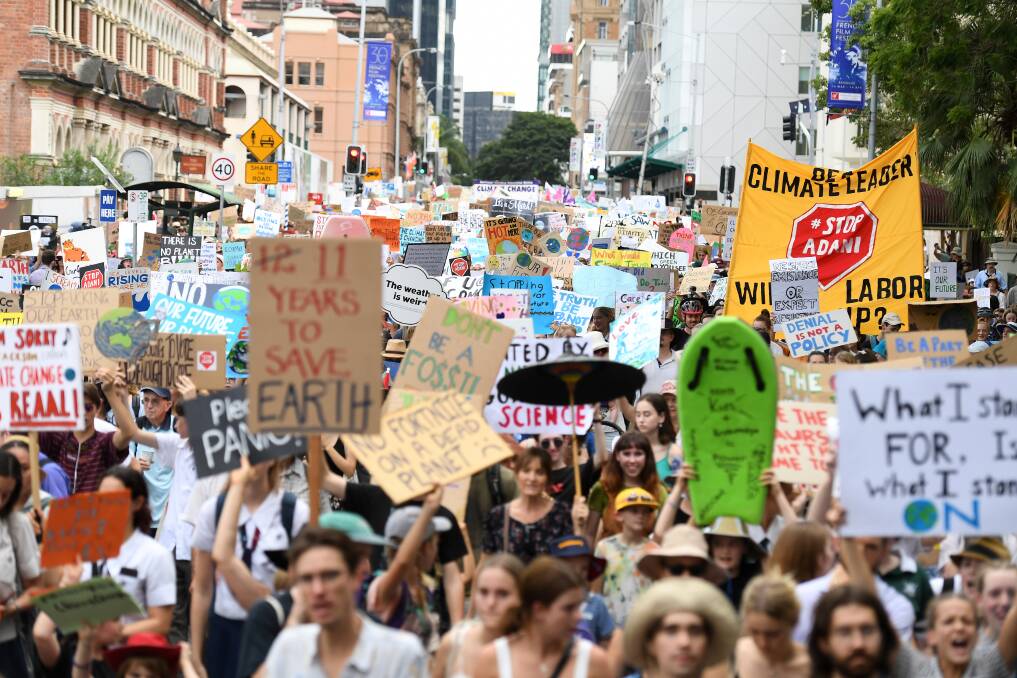 School students take part in a climate change strike in Brisbane. Photo: AAP