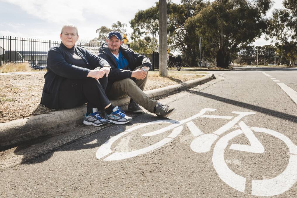 Philippa Horner and Southside market manager Wayne Skein sit next to where people are being fined. There has been a recent "spike" in infringements being issued.  Photo: Jamila Toderas 
