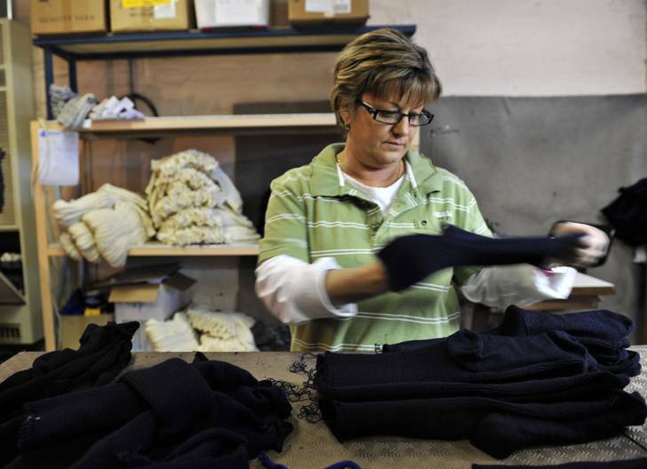 Quality control inspector of Lindner Quality socks Robyn Smith inspects the socks. Photo: Jay Cronan