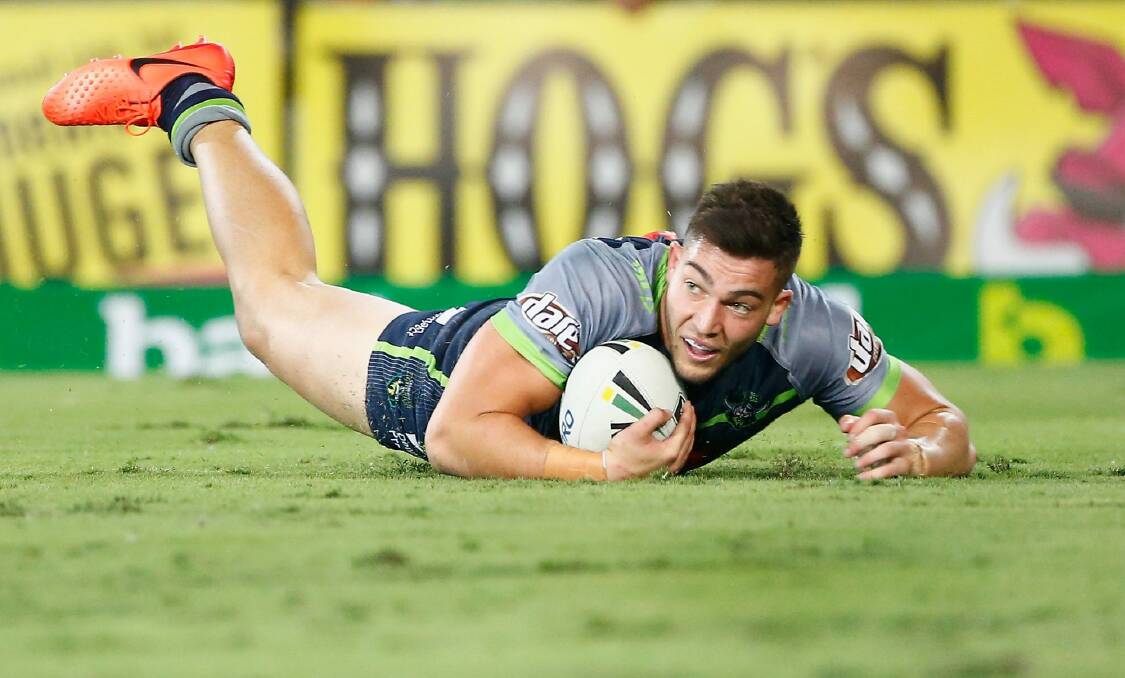Raiders youngster Nick Cotric scores a try against the Titans. Photo: Getty Images