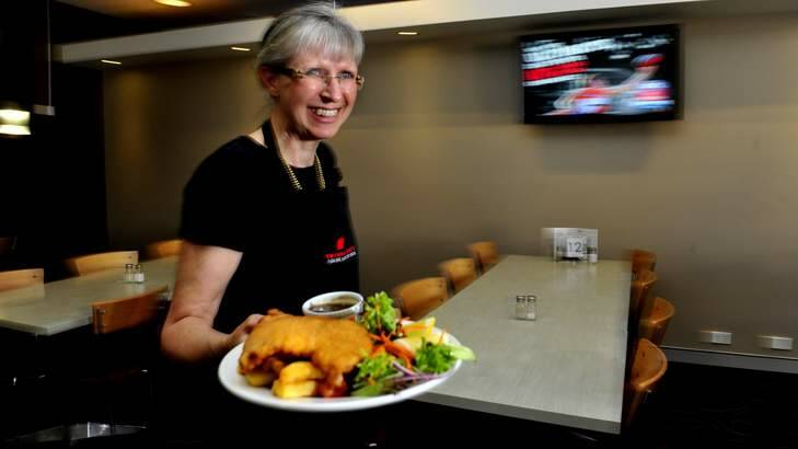 Eastlake bistro manager Janet Craig of Kingston with the chicken schnitzel meal at the club. Photo: Melissa Adams