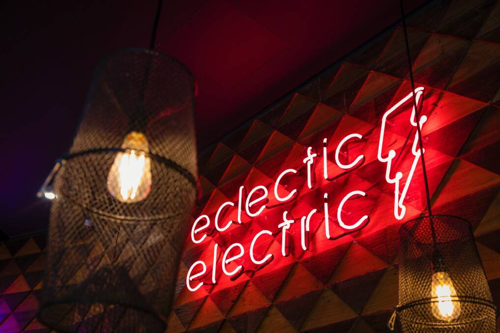 Flashing red neon makes it impossible to miss the hyper-hip eatery. Photo: Sitthixay Ditthavong