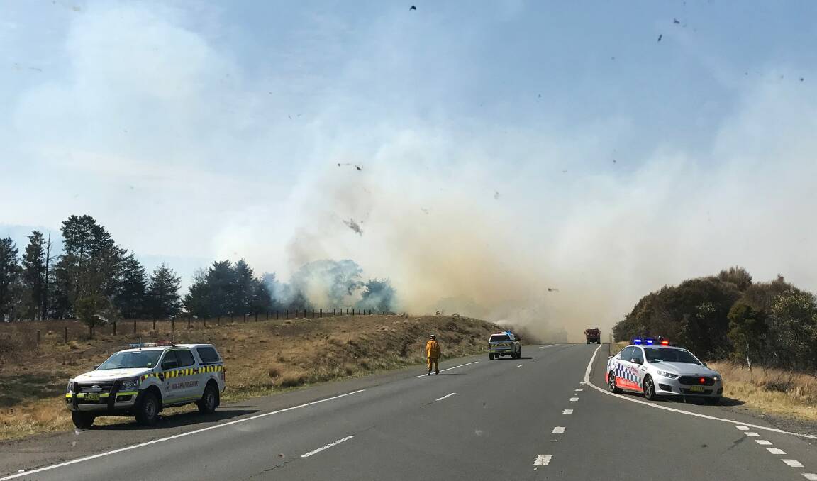 A grass fire is seen along the Hume Highway, north of Goulburn. Photo: Lisa Martin