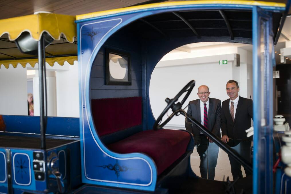 Canberra Airport managing director Stephen Byron and National Museum director Mathew Trinca inspect the Model T Ford used to promote Aeroplane Jelly. Photo: Rohan Thomson