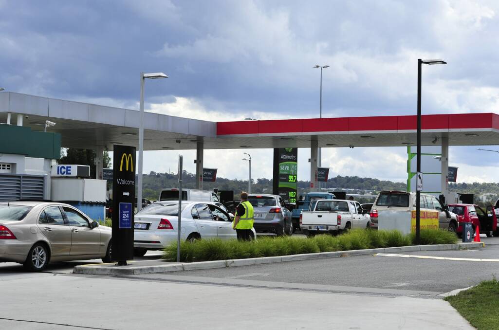 Vehicles are directed around the back of Jim Murphy Airport Cellars to purchase fuel at the Majura Park Caltex.  Photo: Melissa Adams