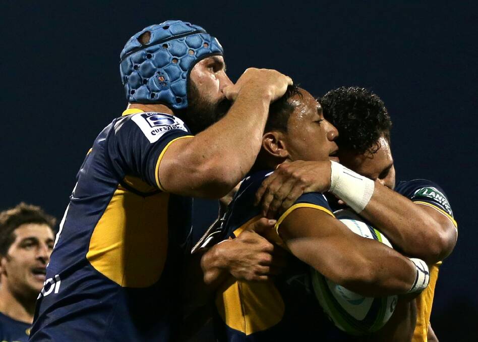 Christian Lealiifano of the Brumbies celebrates scoring a try with team mates during the round two NRL match between the Brumbies and the Waratahs at GIO Stadium on March 4.  Photo: Mark Metcalfe