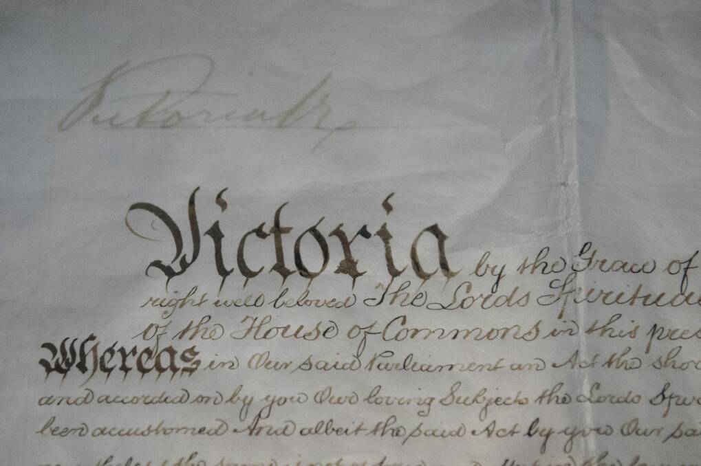 The Royal Commission of Assent signed by Queen Victoria on 9 July 1900 made Australia's constitution law. Her faded signature at the top of the document has never been retouched and must be limited to light exposure.    