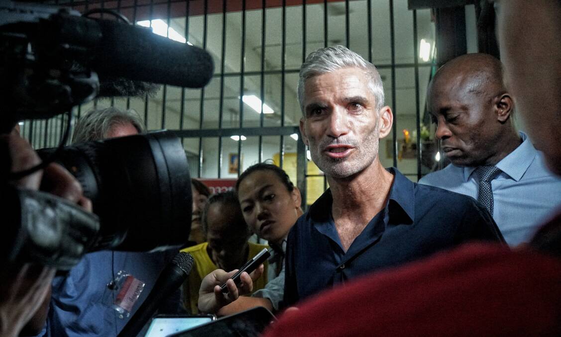 Craig Foster, left, and Francis Awartefe address the media outside the Thai court where Hakeem al-Araibi faces his extradition trial. Photo: Amilia Rosa