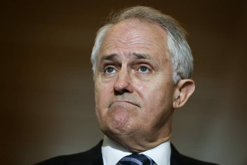 Communications Minister Malcolm Turnbull says the attraction of a free vote for MPs on same-sex marriage was that it would resolve the issue before the election. Photo: Alex Ellinghausen