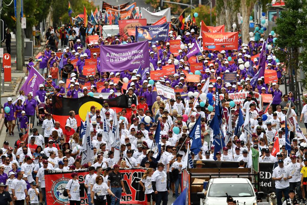 Thousands of union members took to the street in Brisbane on Monday for the annual Labour Day march. Photo: Darren England/AAP