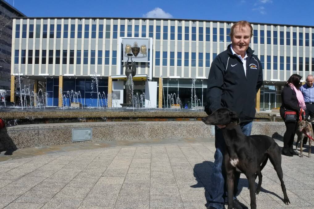 Breeder Alan Tutt with his greyhound Liz outside of the ACT Legislative Assembly on Friday Photo: Christopher Knaus