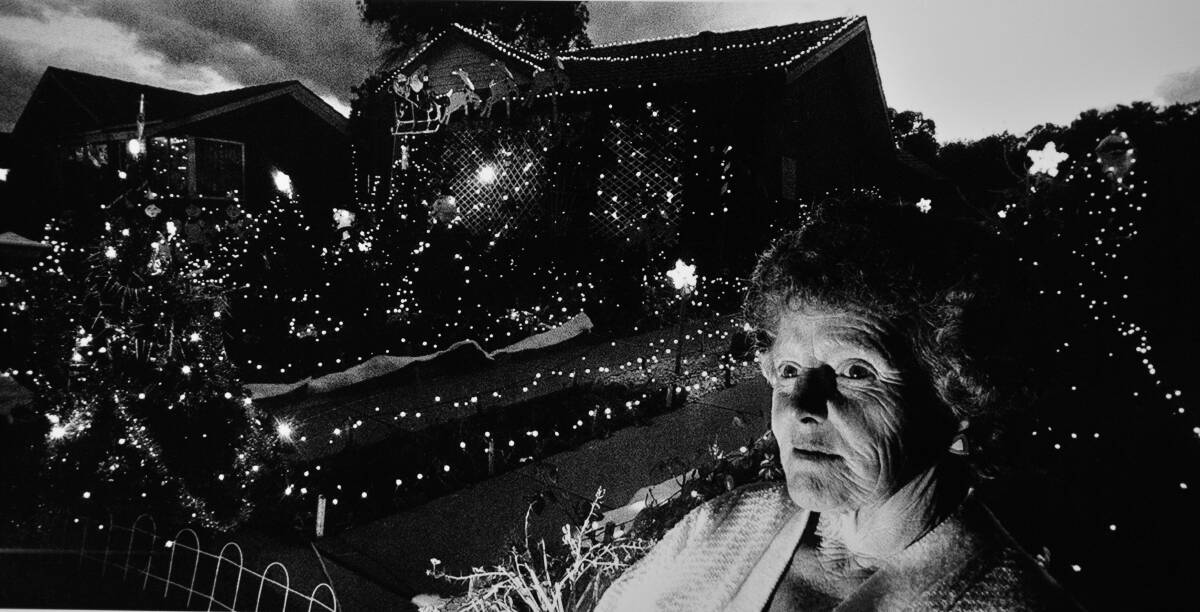 Bev Lucas outside her then home in Walker Crescent, Narrabundah, with her Christmas lights in 1983. Photo: Fairfax Media