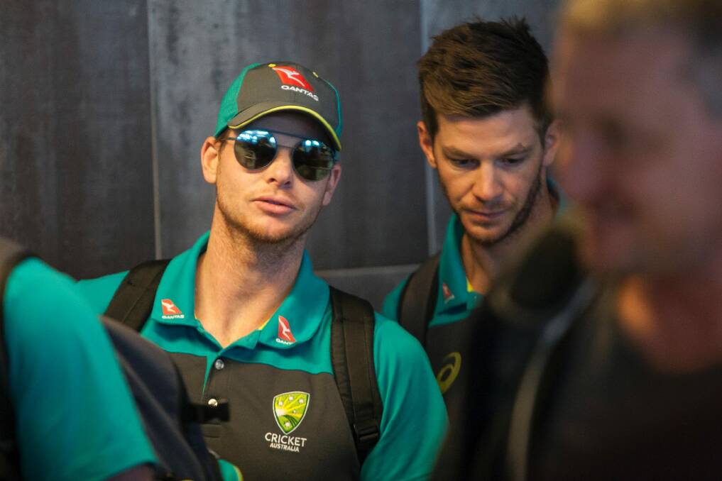 Australian cricket captain Steve Smith, left, arrives with teammates, at the Cape Town International airport to depart to Johannesburg for the final five day cricket test match, in Cape Town, South Africa, Tuesday, March 27, 2018. Smith has been suspended by the International Cricket Council for the match for his part in a ball tampering scandal during the third test. Smith admitted some senior players were aware of the tampering attempt. (AP Photo/Halden Krog) Photo: Halden Krog