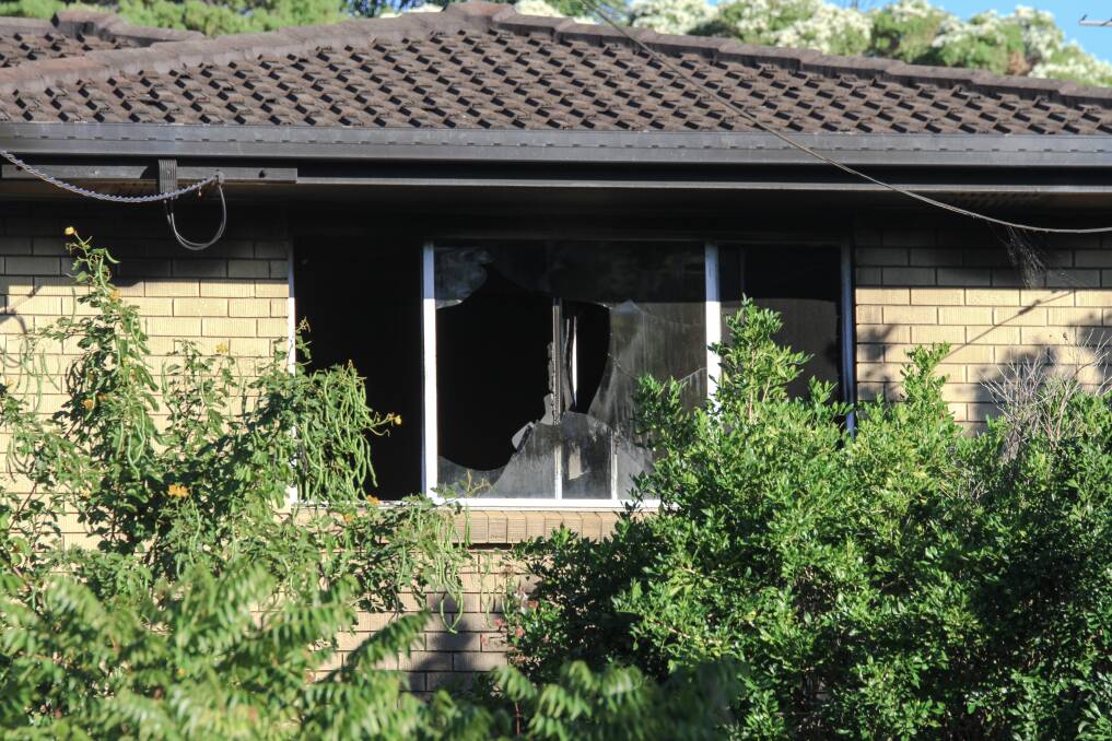 A window was smashed in the fire. Photo: Jorge Branco/Fairfax Media.