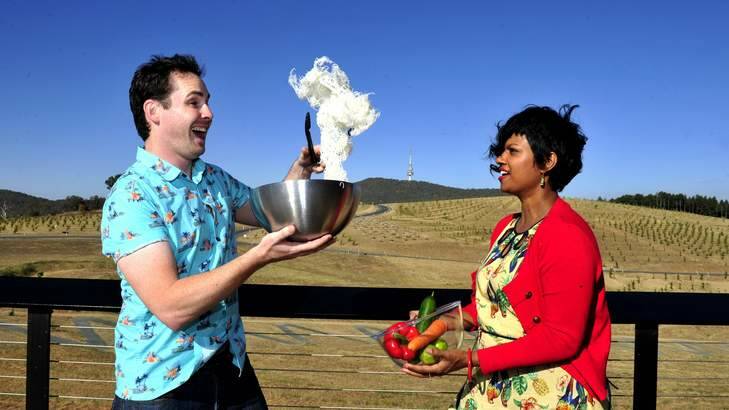TWO LOCALS IN THE MIX: Canberra's first My Kitchen Rules contestants Andrew Hinge and Emelia Vimalasiri show off their cooking skills with flair at the National Arboretum on Thursday. Photo: Melissa Adams