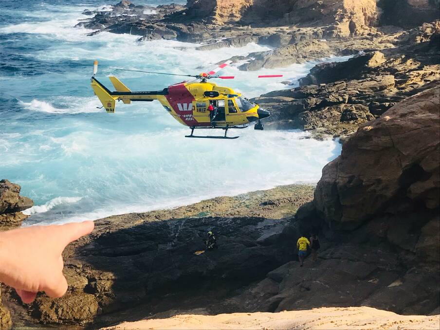 The Westpac Life Saver Rescue Helicopter winched four children to safety at Bermagui after they became stranded on the rocks as the tide came in on Tuesday, January 15, 2019.  Photo: Cheryl McCarthy