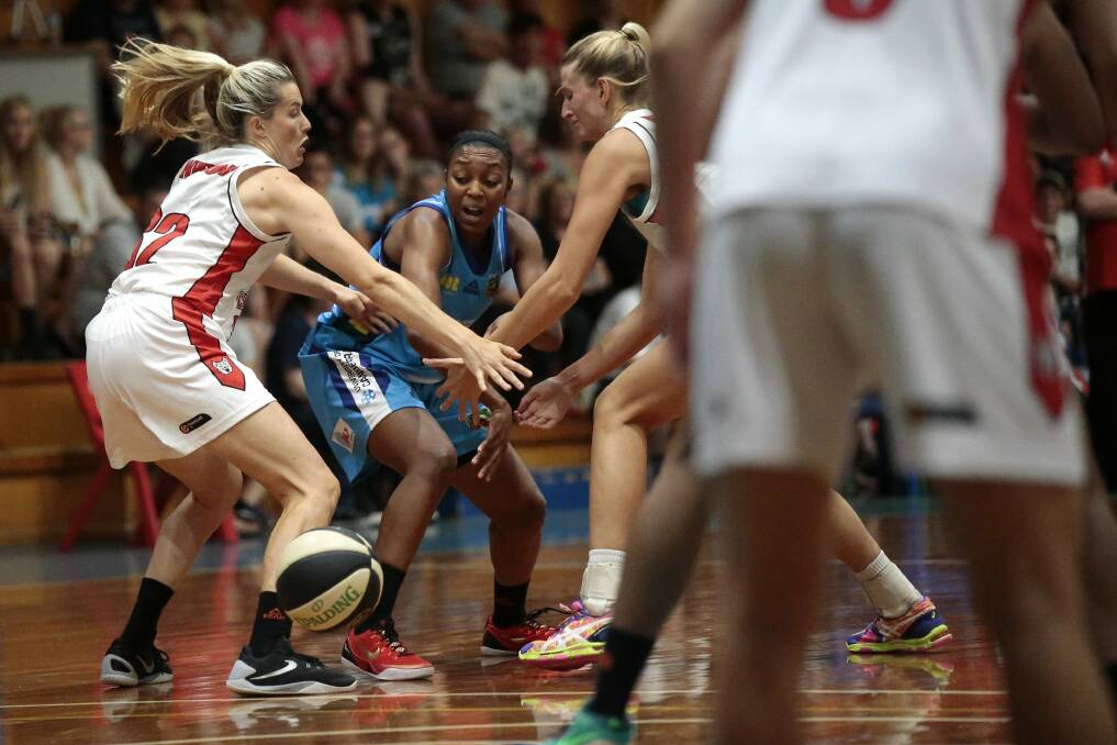 Canberra's Renee Montgomery can't escape Perth's tight defence in a 89-63 loss. Photo: Jeffrey Chan