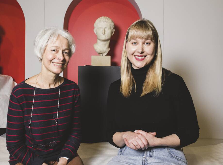 Head registrar Sara Kelly, and curator Dr Lily Withycomb, both of the National Museum of Australia, with the head of Augustus Caesar. Photo: Jamila Toderas