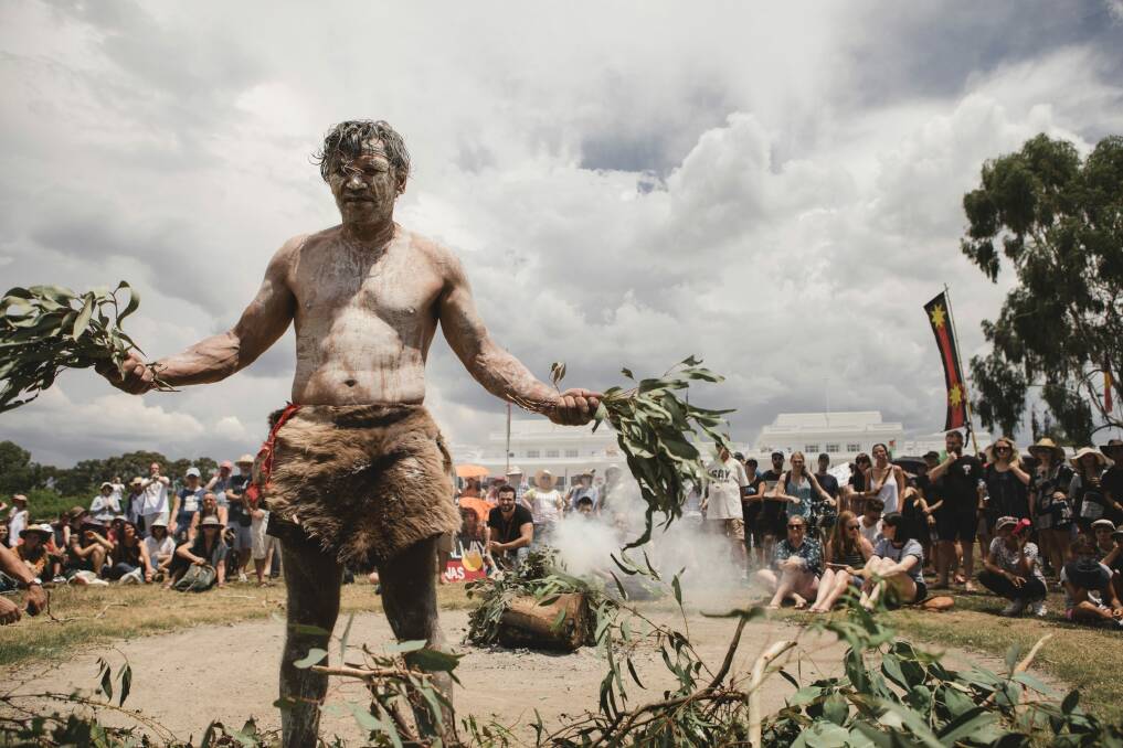 The 'invasion day' protest in Canberra. Pictured is Kumba, the fire keeper.  Photo: Jamila Toderas