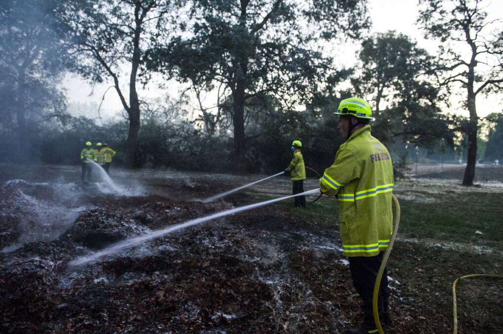 ACT Fire and Rescue has extinguished a small grass fire at Woden Cemetery.  Photo: Dion Georgopoulos