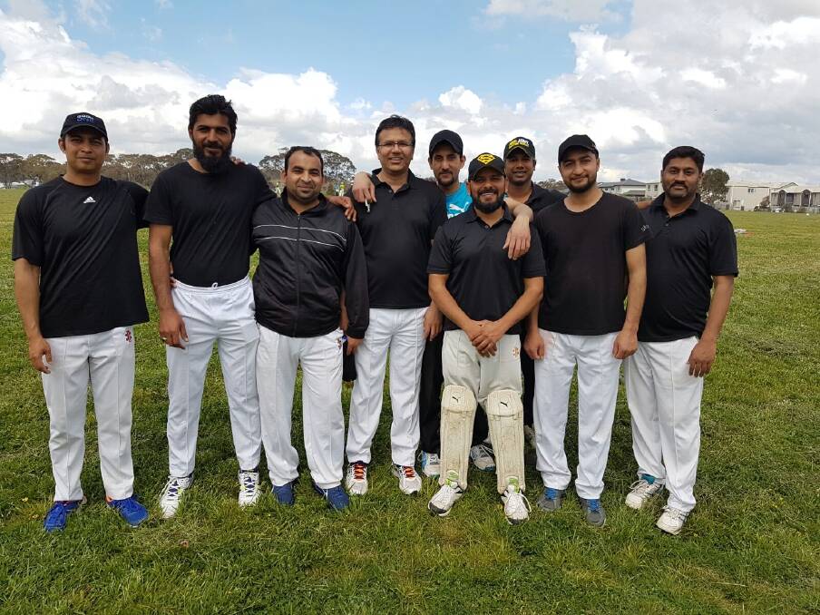 Zeeshan Akbar (back centre) with his cricket mates from the 'Canberra Sharks'.  Photo: Supplied