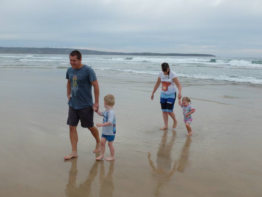 Toby Jamieson (left) at the beach with his son William, wife Linda and daughter Sophie in 2016. Photo: Jamieson family