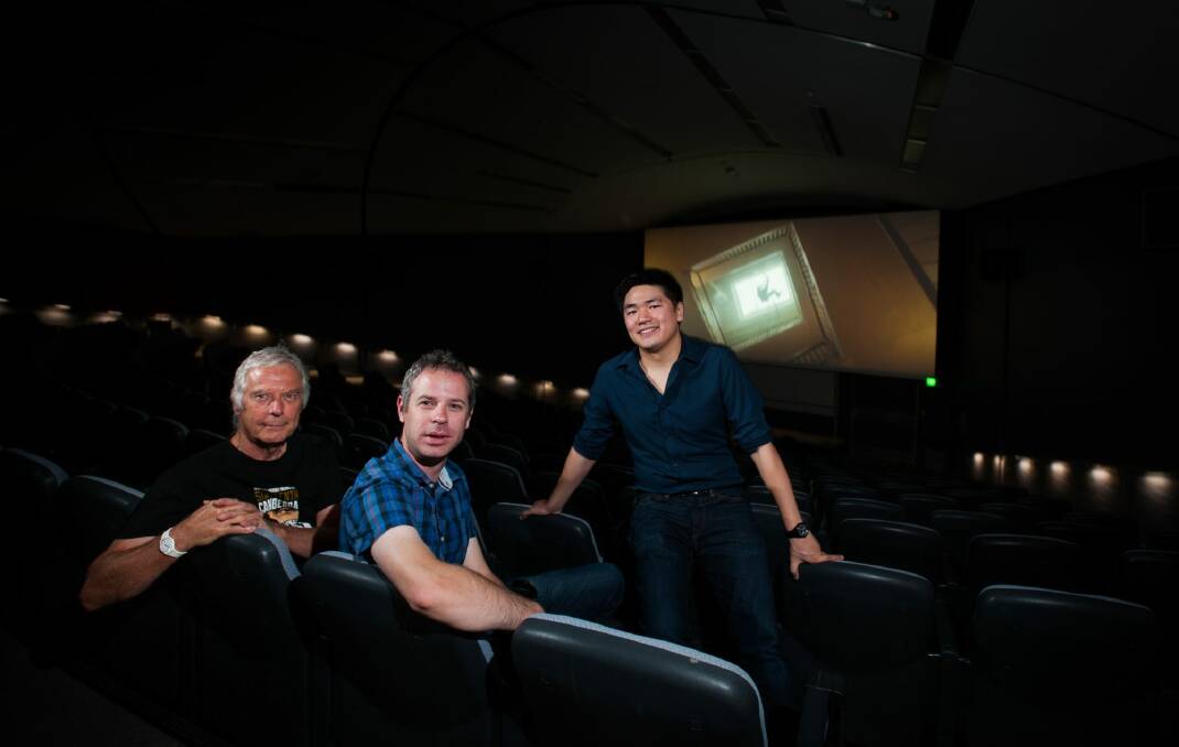 ANU Film Group members, from left,  Brett Yeats, secretary Andrew Wellington and President Adrian Ma, in the Coombs Theatre. Photo: Elesa Kurtz