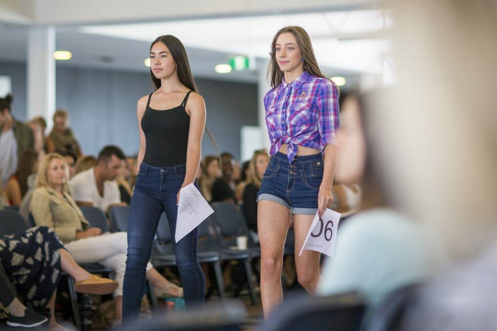 Nicole Collins and Claire Mackey on the catwalk during the Fashfest model callout at the National Convention Centre, Canberra. Photo: Matt Bedford
