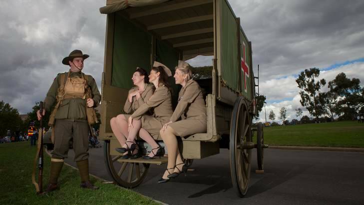 Phillip Hunting from the Australian Great War Association stands with the female vocal trio 'The Stilettos' (from left) Janie Lawson, Sally Jackson and Tina Meir. Photo: Katherine Griffiths