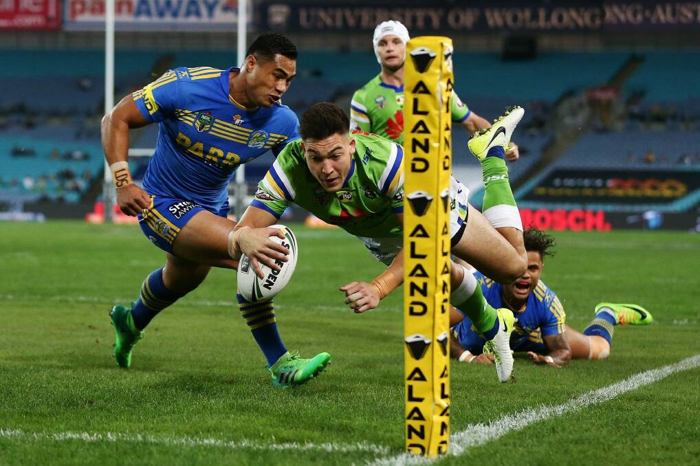 SYDNEY, AUSTRALIA - MAY 20: Nikola Cotric of the Raiders dives to score a try during the round 11 NRL match between the Parramatta Eels and the Canberra Raiders at ANZ Stadium on May 20, 2017 in Sydney, Australia. (Photo by Brendon Thorne/Getty Images) Photo: Getty Images
