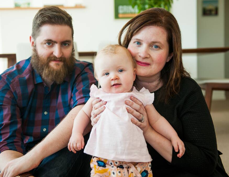 Caitlin Moorhouse with nine-month-old Violet and husband David was diagnosed with stage 4 bowel and liver cancer after Violet was born. Photo: Elesa Kurtz