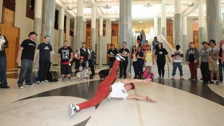 Breakdancers from the Ted Noffs Foundation perform in the marble foyer to raise awareness about multicultural grants, at Parliament House. Photo: Alex Ellinghausen