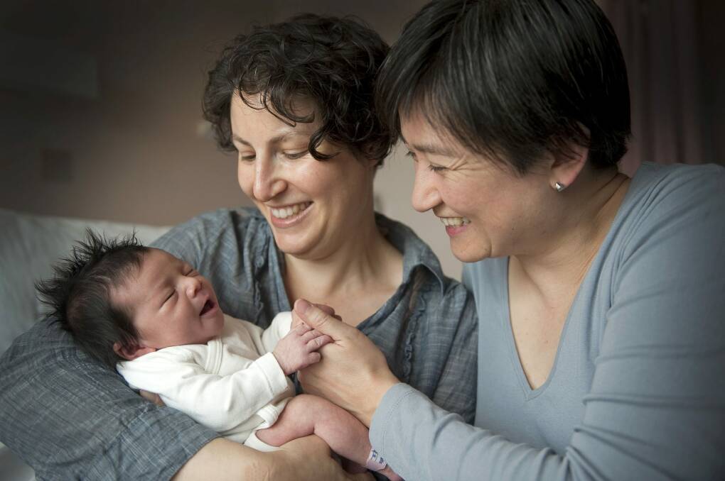 Penny Wong and partner Sophie Allouache and their daughter Alexandra in 2011. Their second daughter, Hannah, was born earlier this year. Photo: David Mariuz 