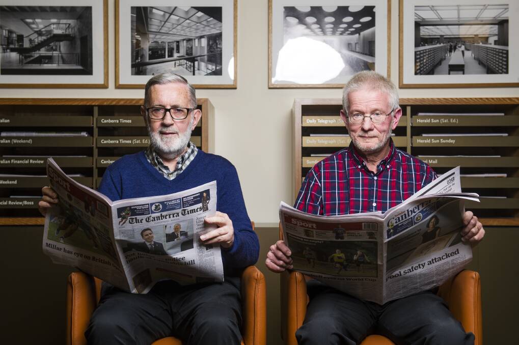 Volunteers John Warren and Neil Hamilton at the National Library of Australia. Photo: Dion Georgopoulos.